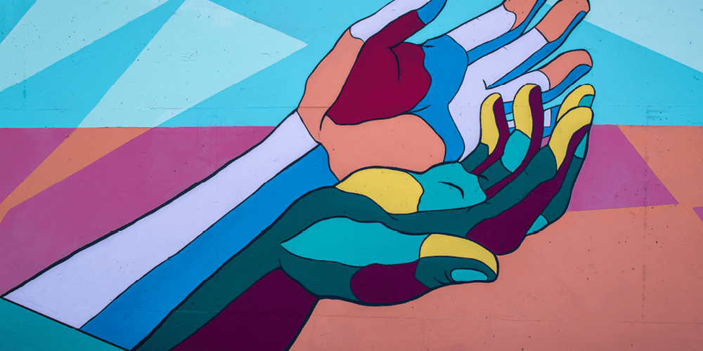 colourful mural with hands outstretched depicting mental health