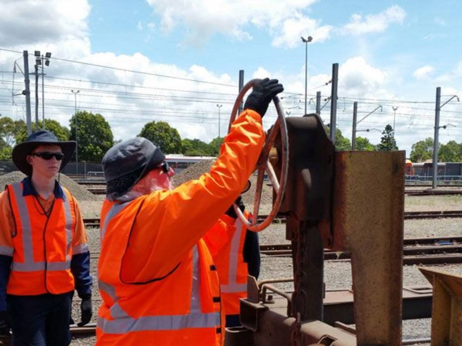 man demonstrating something on locomotive