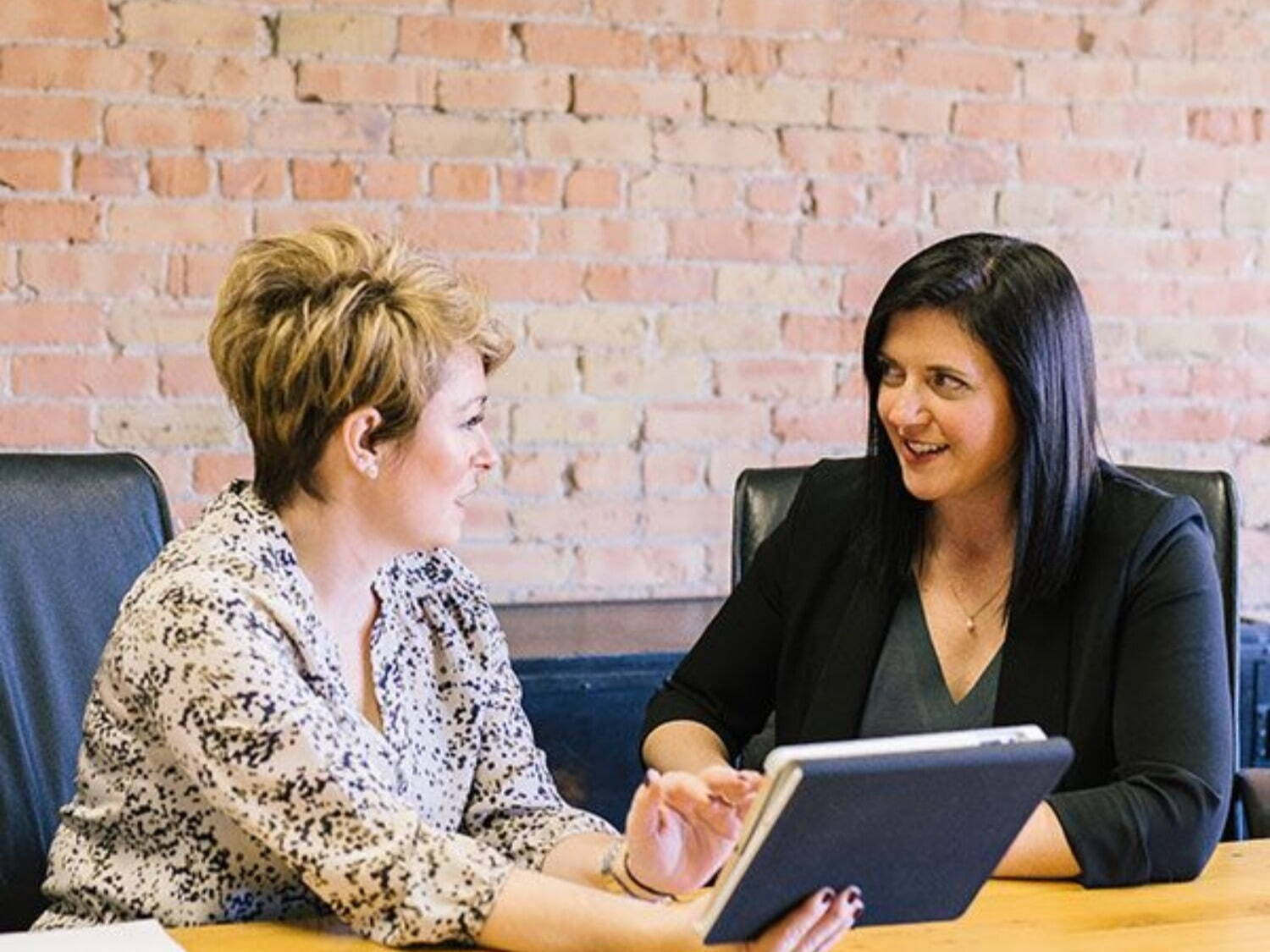 two women having a meeting about consulting services