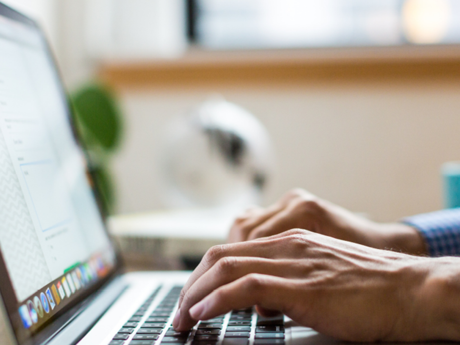 female on laptop logging into online timesheets